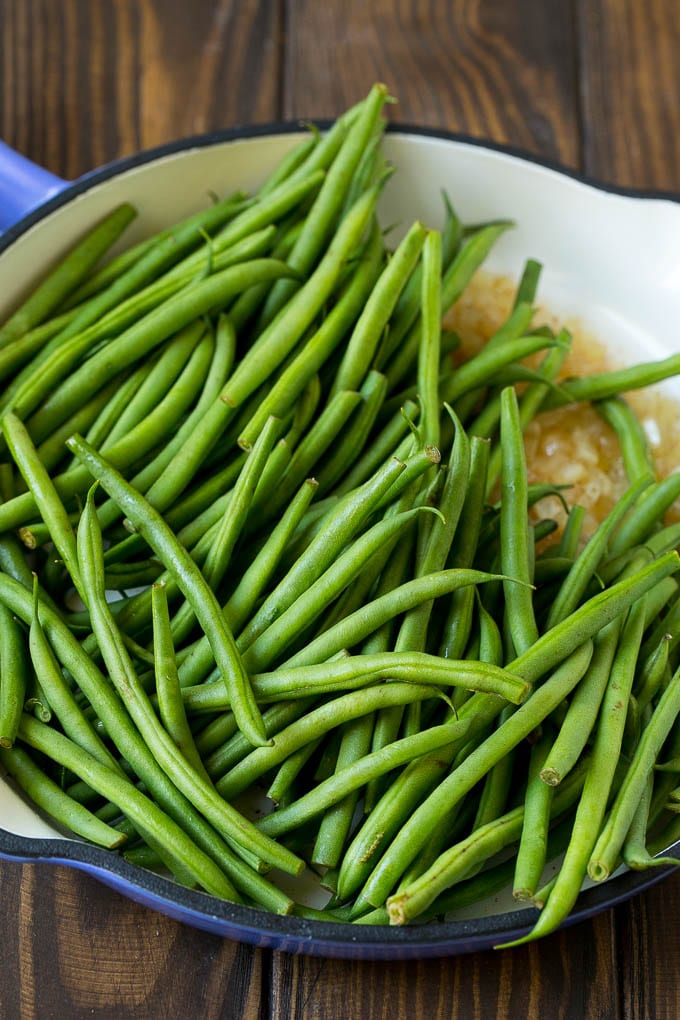 Green Beans with Bacon Recipe | Bacon Green Beans #bacon #greenbeans #sidedish #thanksgiving #veggies #dinner #dinneratthezoo Beans in a pan with onions.