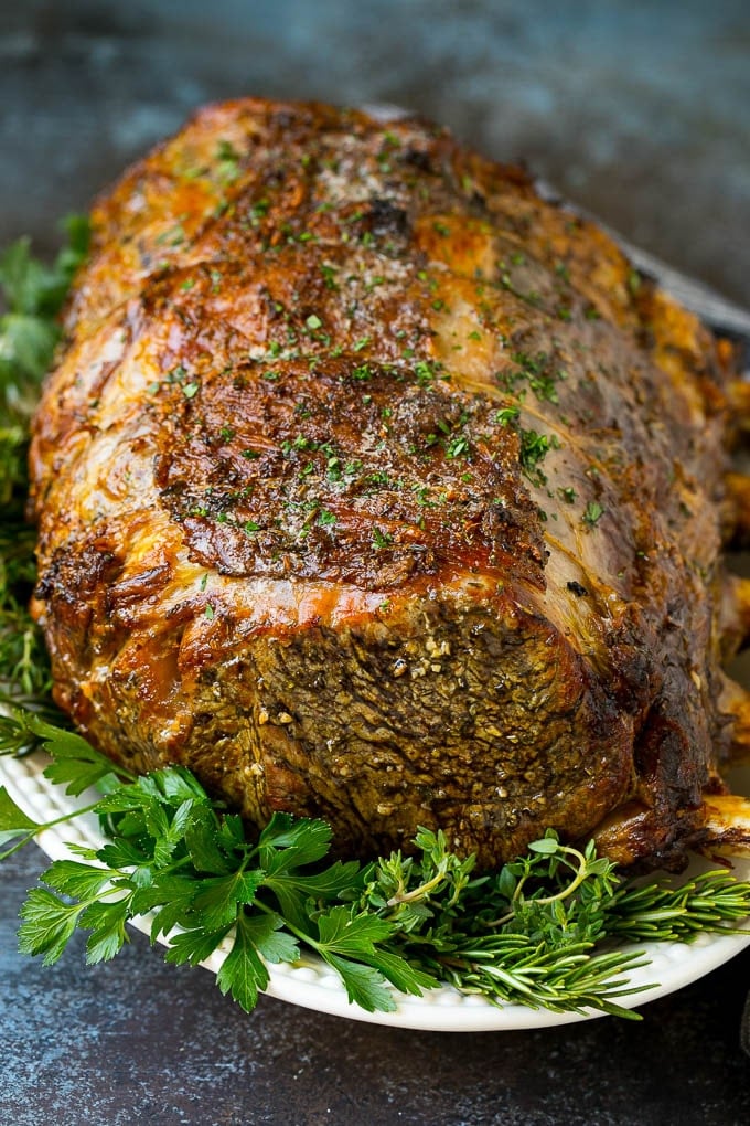 A roasted prime rib on a serving platter.
