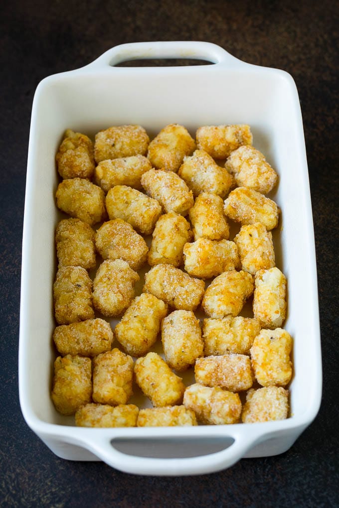 Potato tots in a casserole dish.