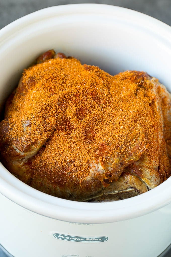 Pork shoulder coated in spice rub.