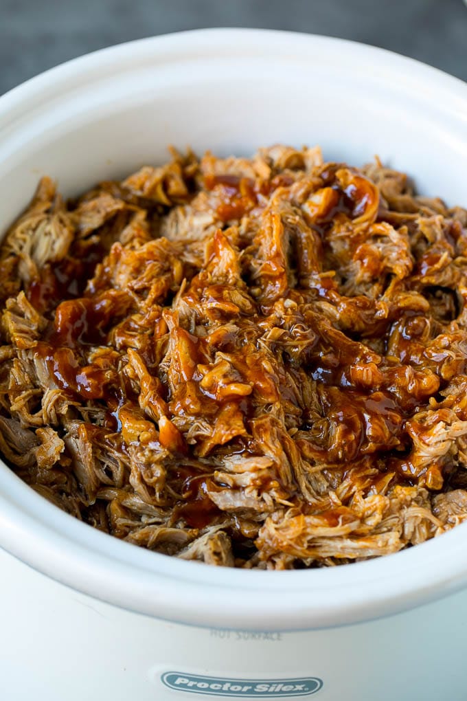 Slow cooker pulled pork, shredded and tossed in BBQ sauce.