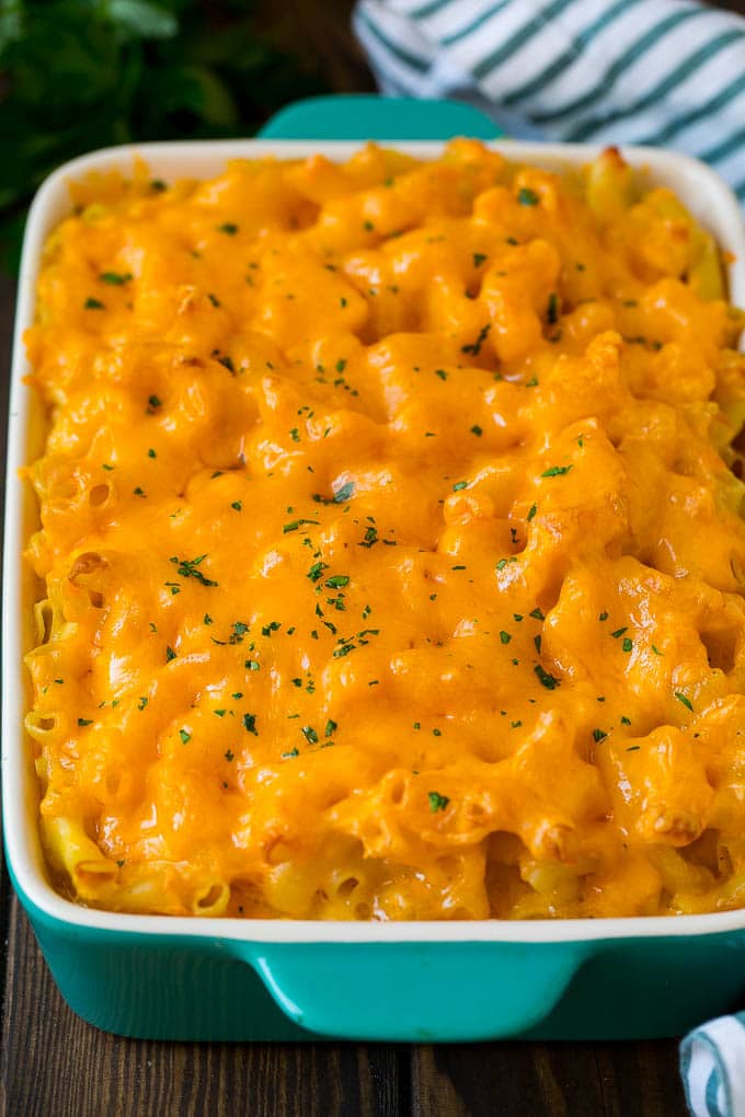 Southern mac and cheese topped with melted cheddar and parsley.