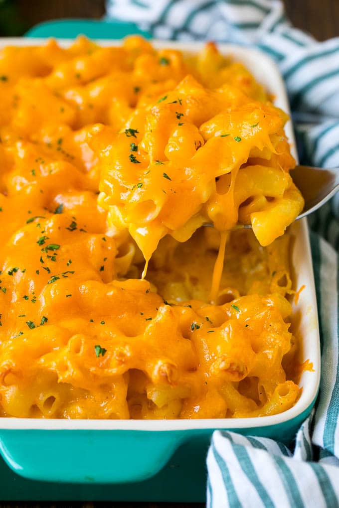 A spoon serving up a portion of Southern mac and cheese.