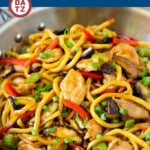 These stir fry noodles are loaded with chicken and colorful vegetables with a savory sauce.