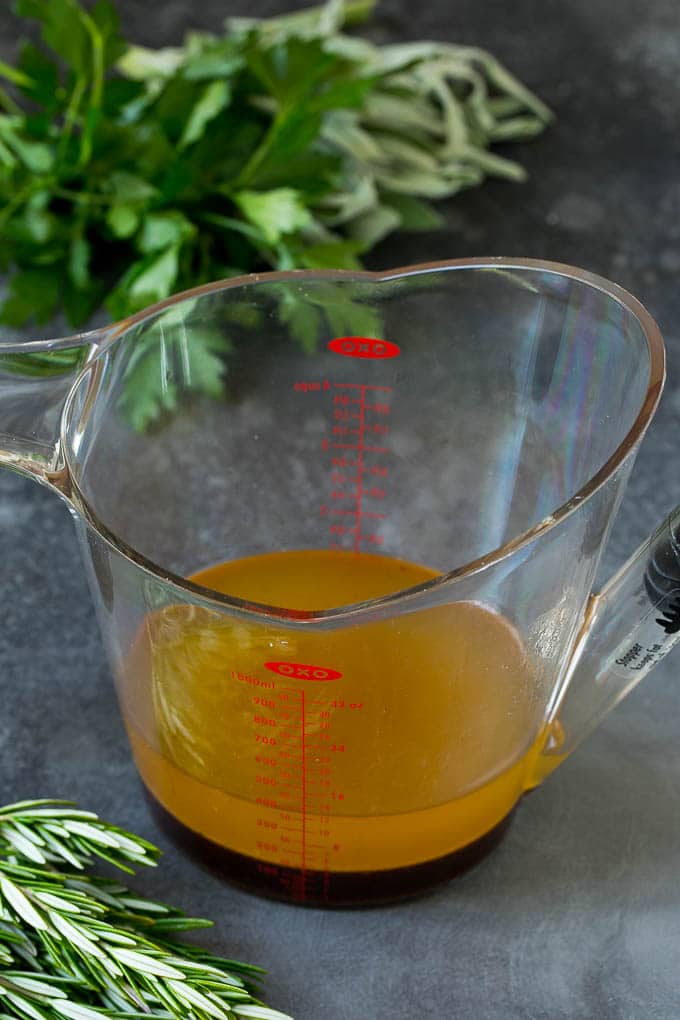 A fat separator filled with turkey drippings.