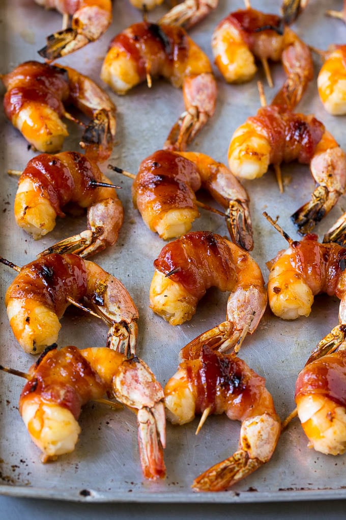 Roasted shrimp with a piece of bacon around each one.