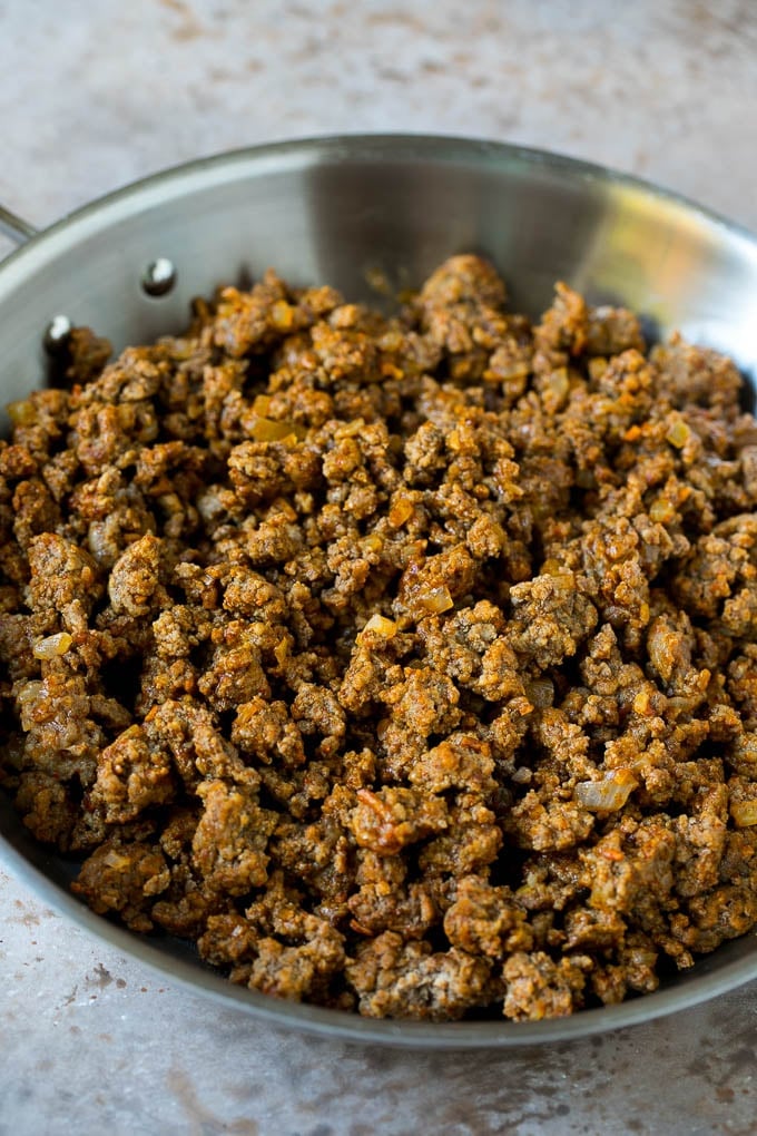 Seasoned ground beef in a skillet.