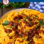 This recipe for butternut squash pasta is spaghetti tossed in a creamy butternut squash sauce, then topped with bacon and herbs.