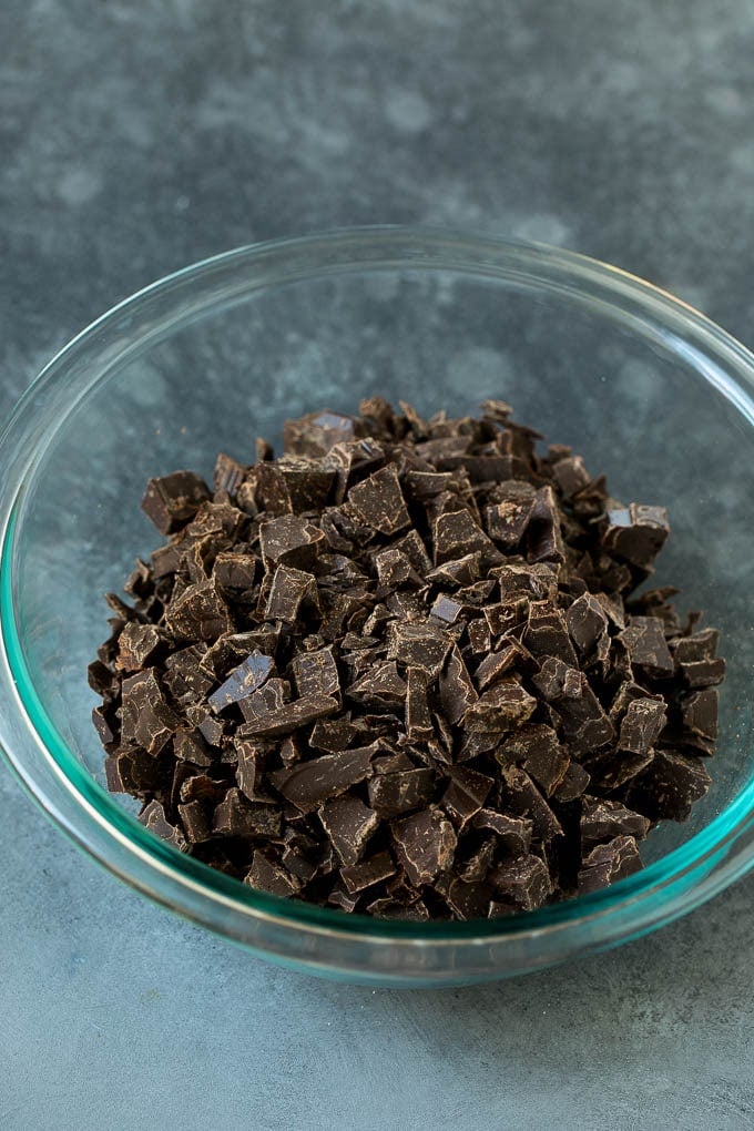 Chopped chocolate in a mixing bowl.