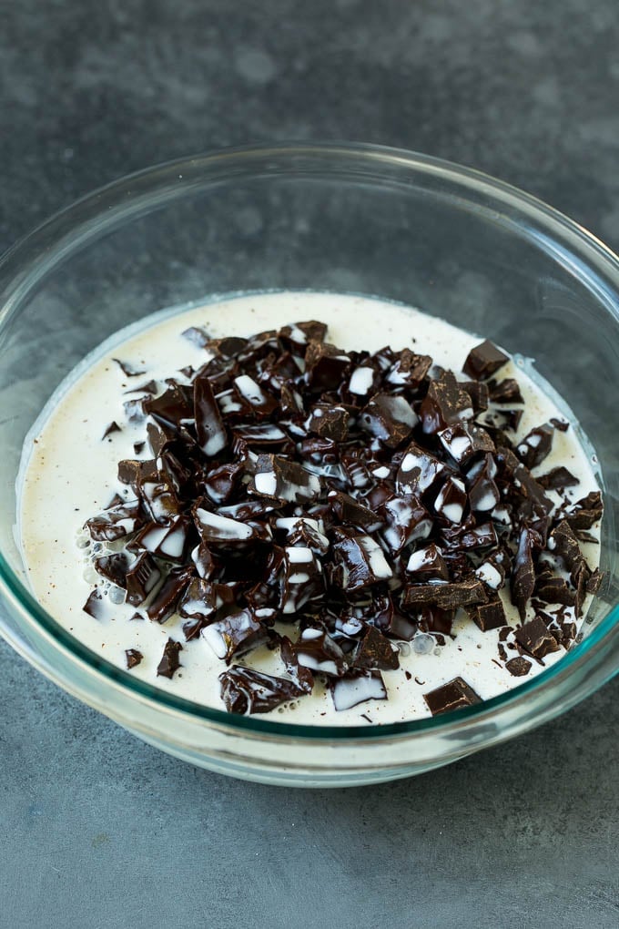 Hot cream poured over a pile of chopped chocolate.