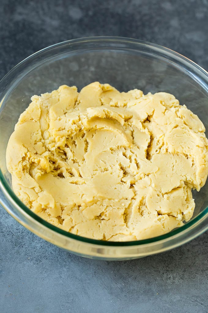 Almond cookie dough in a mixing bowl.