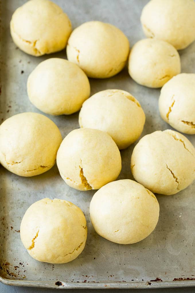 Baked almond cookies on a baking sheet.