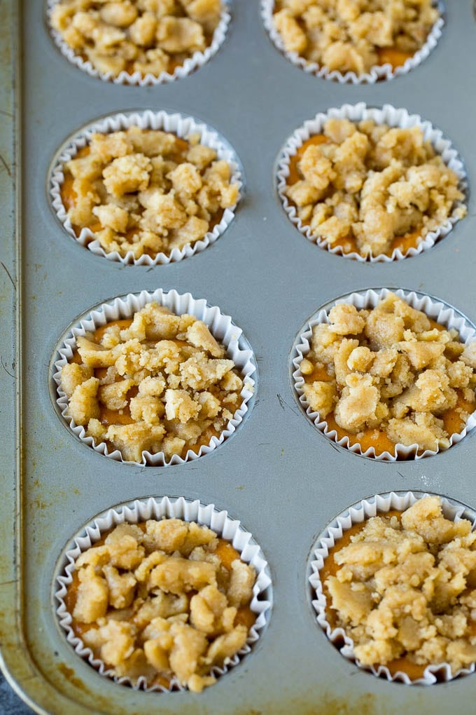 Pumpkin batter in a baking tin, topped with streusel.