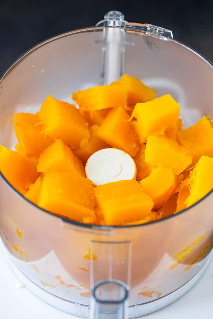 Pumpkin Puree Recipe #pumpkin #baking #fall #thanksgiving #dinneratthezoo Cubes of pumpkin in a food processor.
