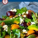 This beet salad is full of red and yellow beets, avocado, feta cheese and pecans, all tossed with greens in a homemade balsamic dressing.