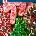 These Christmas sugar cookies are roll out cookies that are frosted with an easy vanilla buttercream and decorated with sprinkles.
