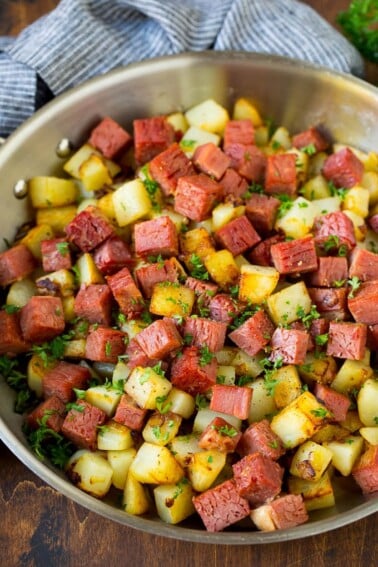 Corned beef hash with potatoes, onions and fresh herbs.