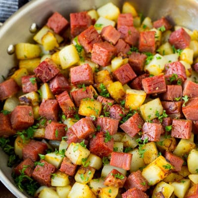 Corned beef hash with potatoes, onions and fresh herbs.