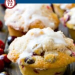 These light and tender cranberry muffins are filled with fresh berries and orange zest, then topped with streusel and a simple orange glaze