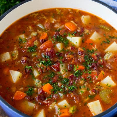 Manhattan clam chowder with tomatoes, potatoes, vegetables and bacon.