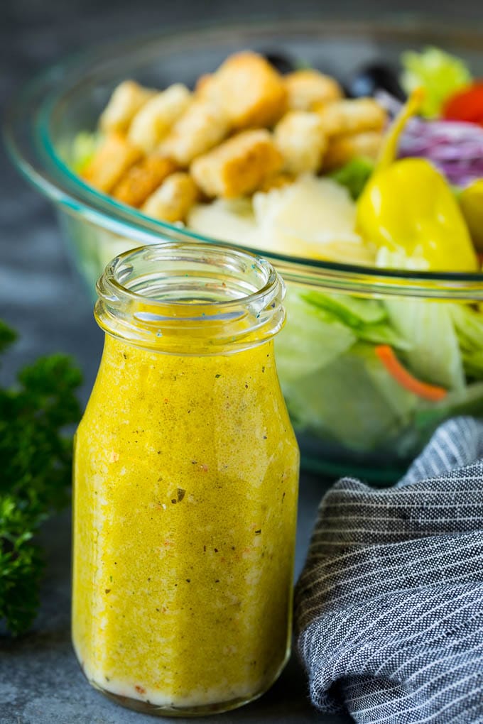 Olive Garden Salad Recipe | Italian Salad #salad #lettuce #olives #sidedish #dinner #dinneratthezoo A bottle of homemade salad dressing.