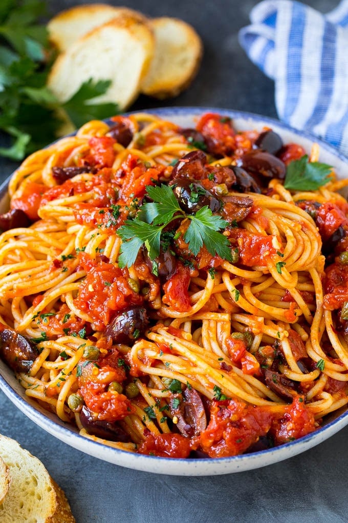 Pasta puttanesca with spaghetti tossed in a homemade tomato sauce.