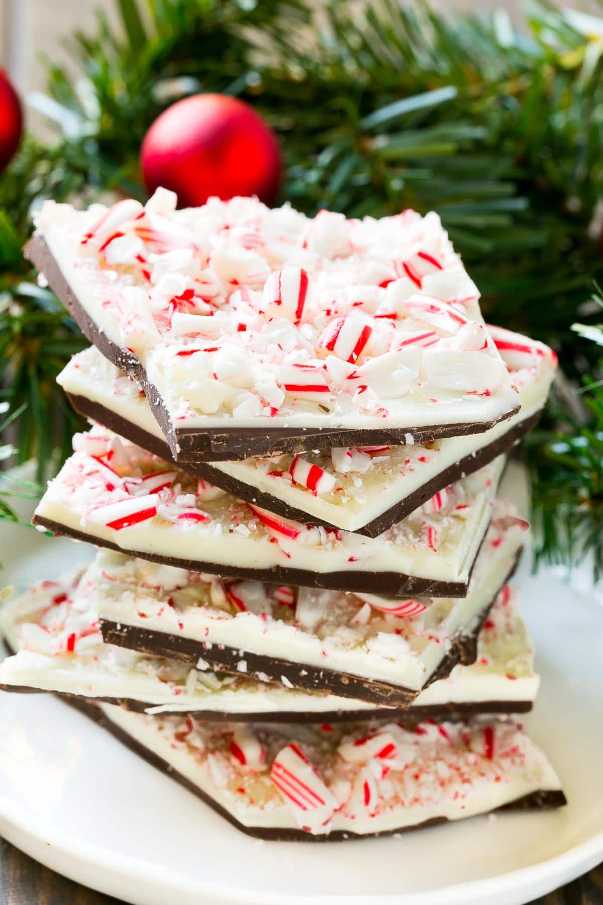 A stack of peppermint bark on a plate.