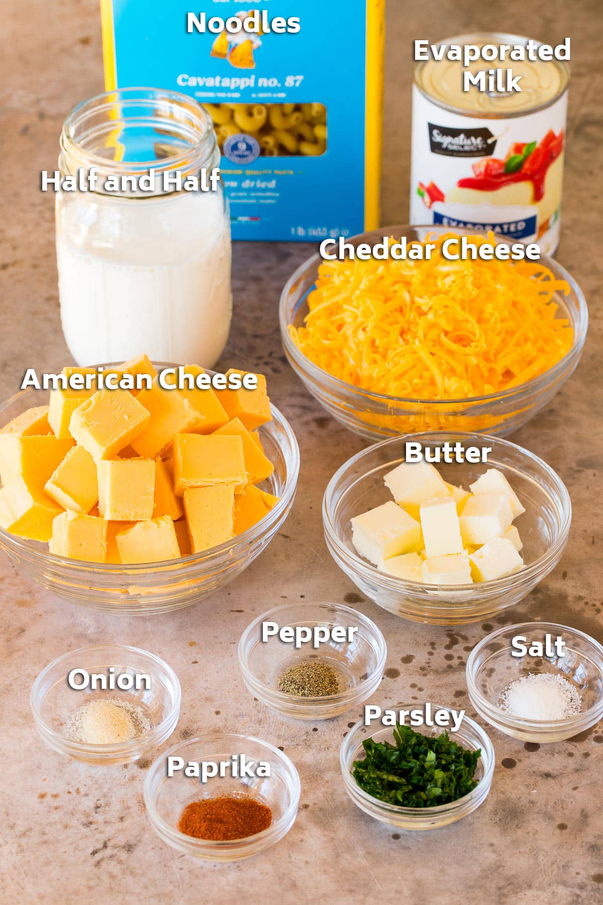 Ingredients including pasta, milk, cheeses, butter and seasonings.