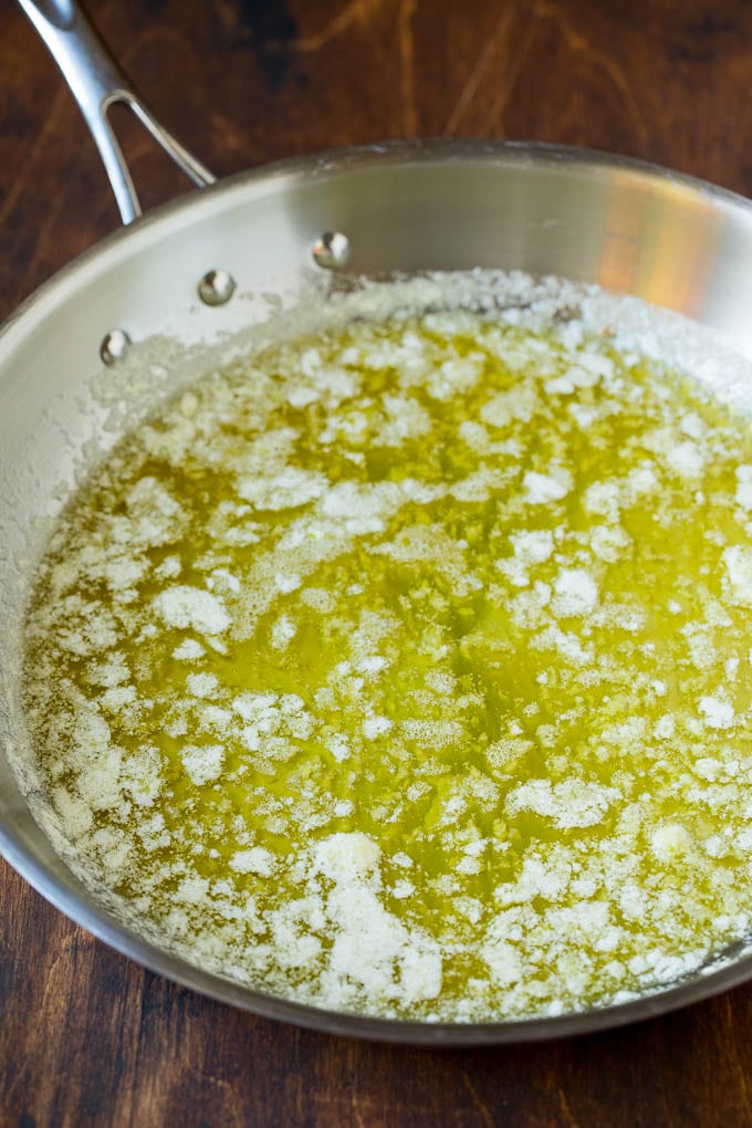 Melted butter with garlic and olive oil in a pan.