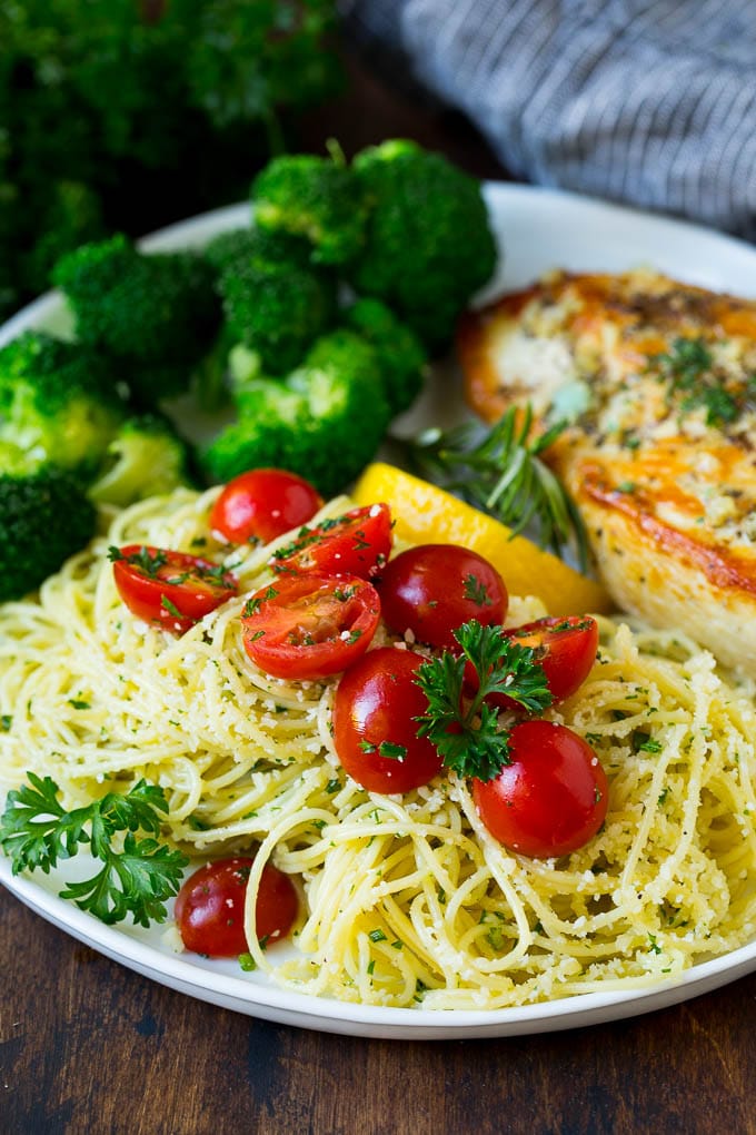 Angel hair pasta served with chicken and broccoli.