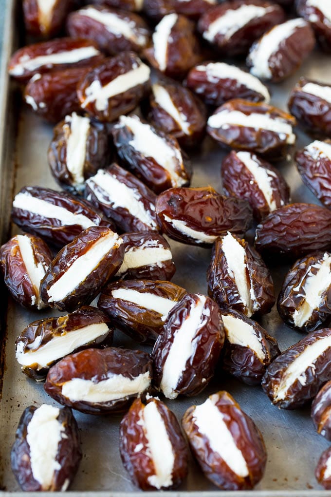 Dates cut in half and filled with goat cheese.