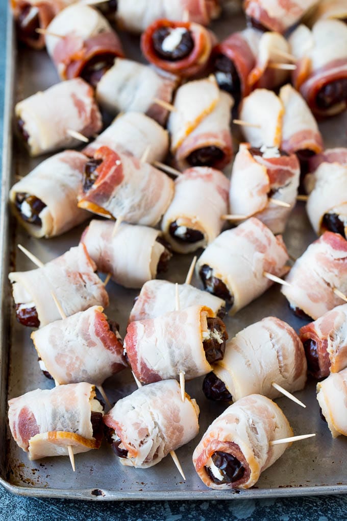 Dates wrapped in bacon and secured with toothpicks.