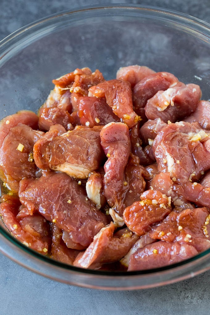Marinated pork slices in a bowl.