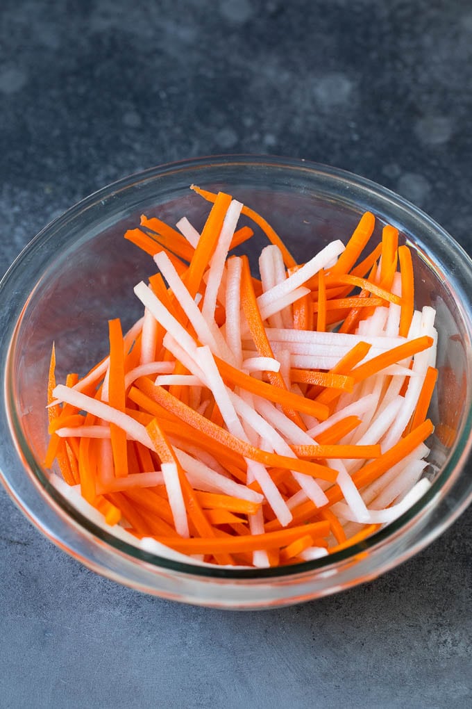 Shredded carrots and daikon radish in a bowl.