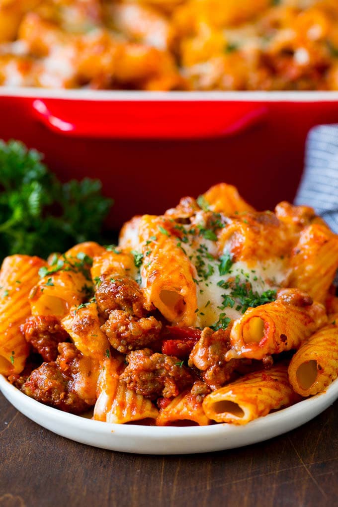 A plate of baked rigatoni topped with melted cheese.