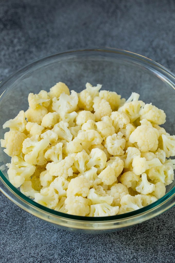 Steamed cauliflower florets in a bowl.