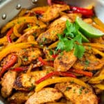 Chicken fajita marinade served over sliced chicken and vegetables.