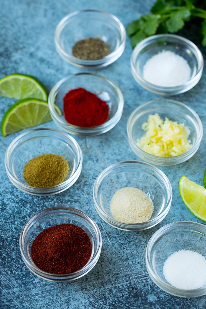 Assorted spices and herbs in bowls.