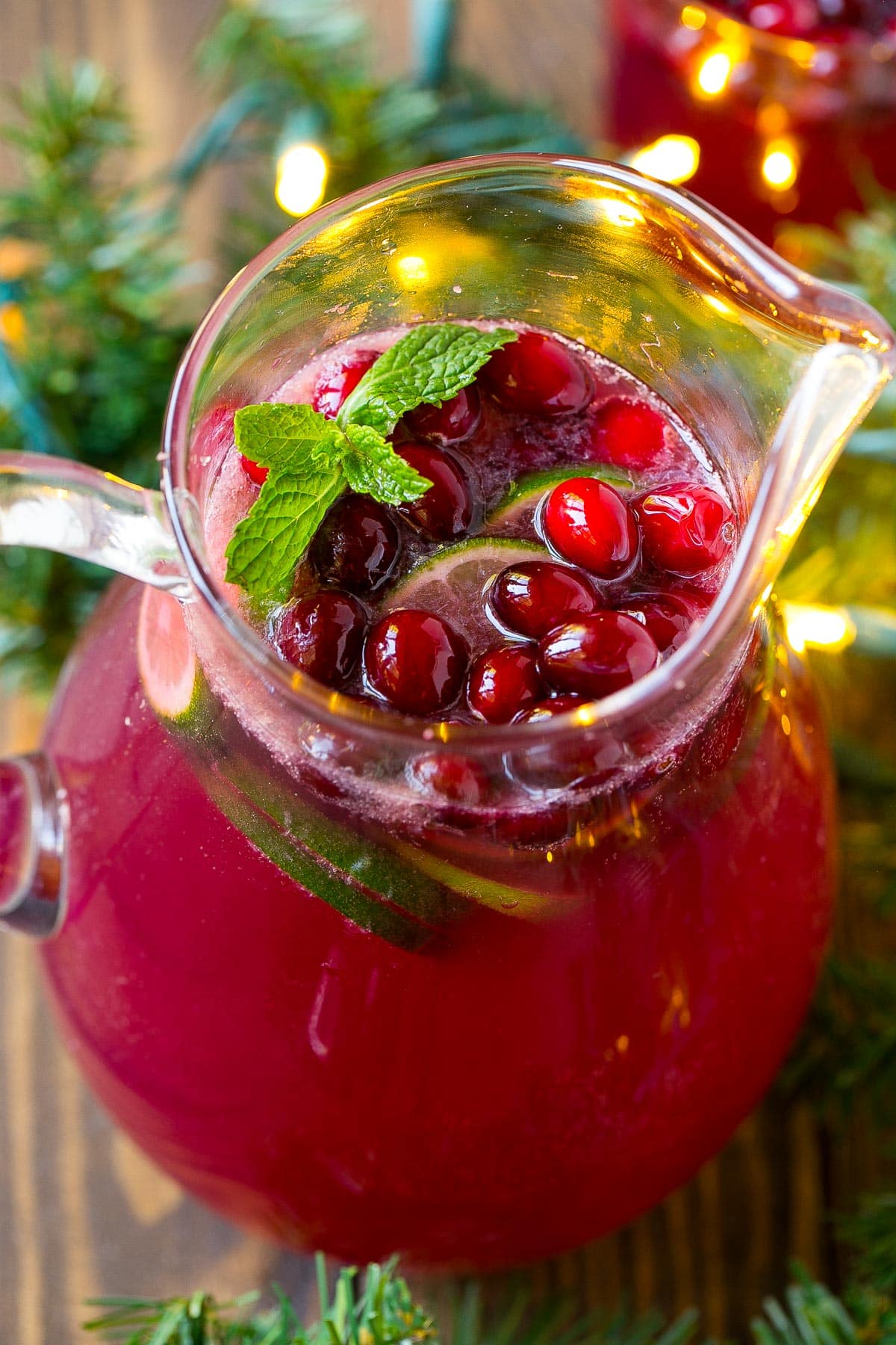 An overhead view of a pitcher full of cranberry punch.