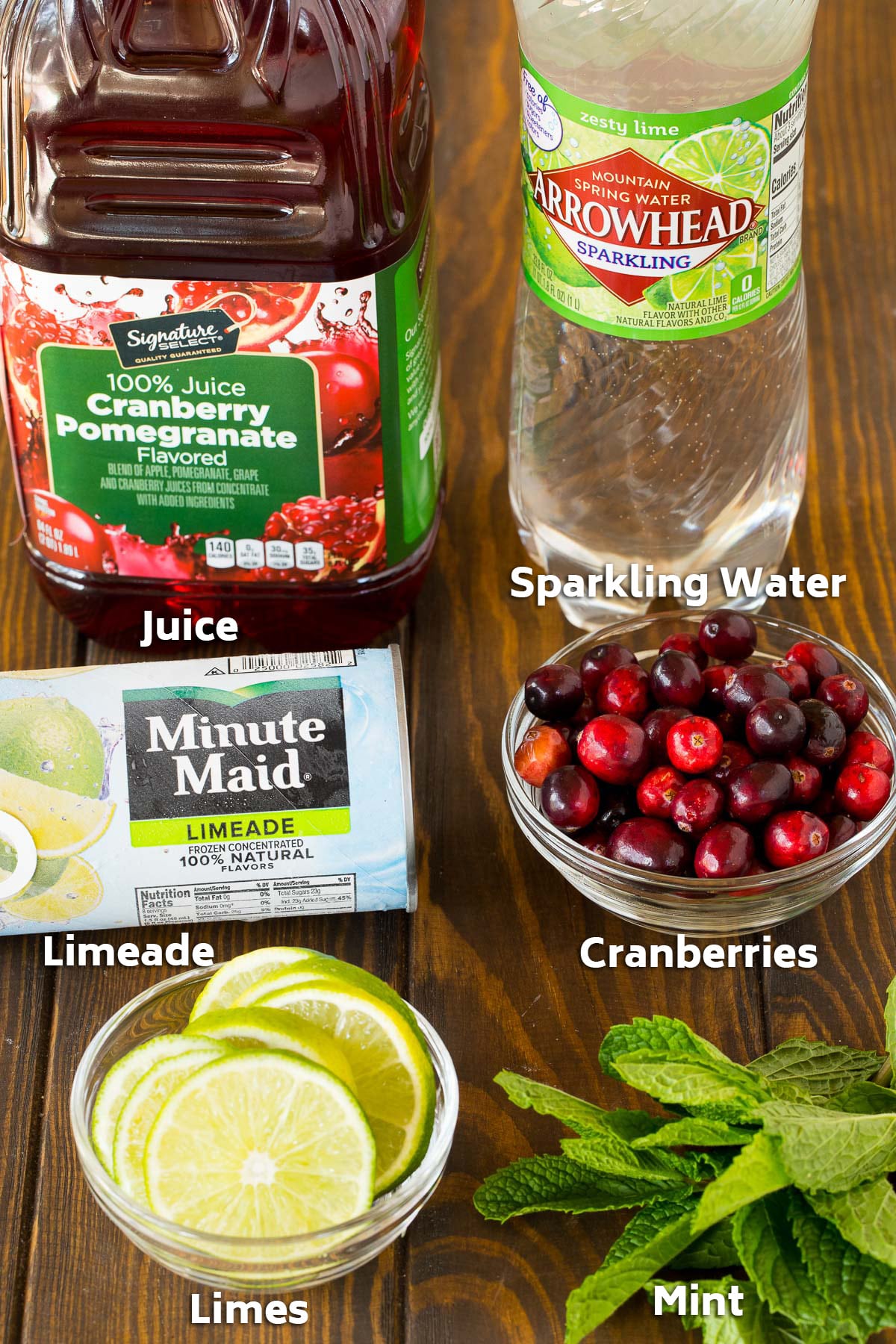 Ingredients including limes, mint, cranberries, juice and sparkling water.