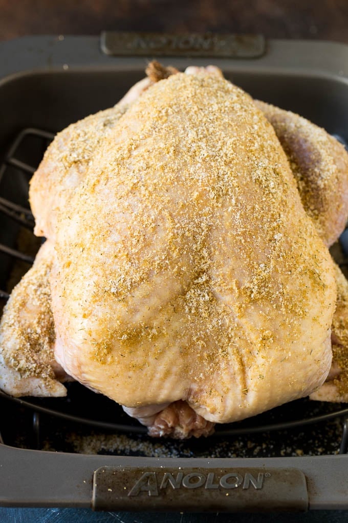 This dry brined turkey is coated in a blend of salt, herbs and spices, then roasted to golden brown perfection. Dry brine rubbed all over a turkey.