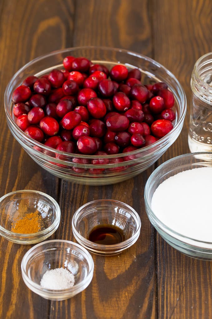 Bowls of cranberries, sugar and seasonings.