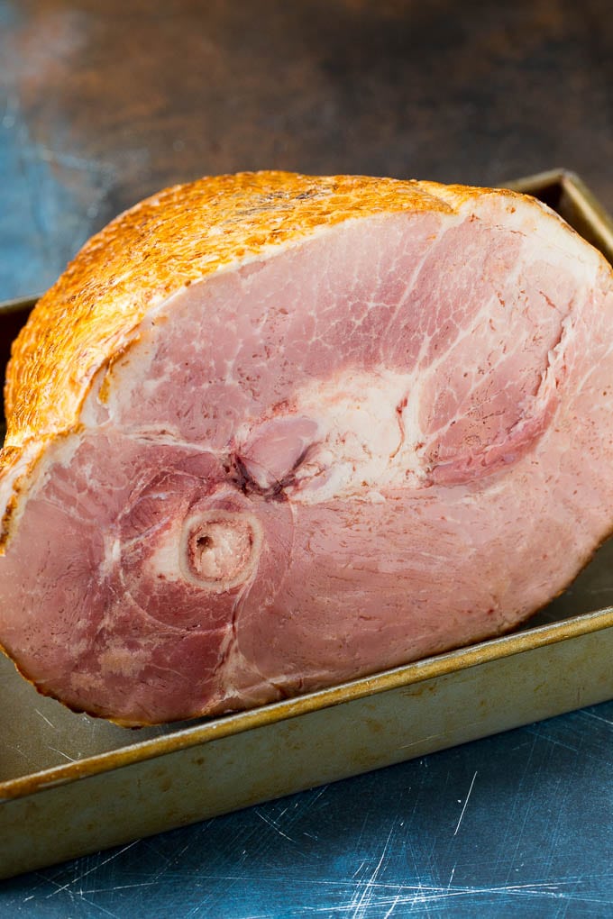 A smoked ham in a baking pan.