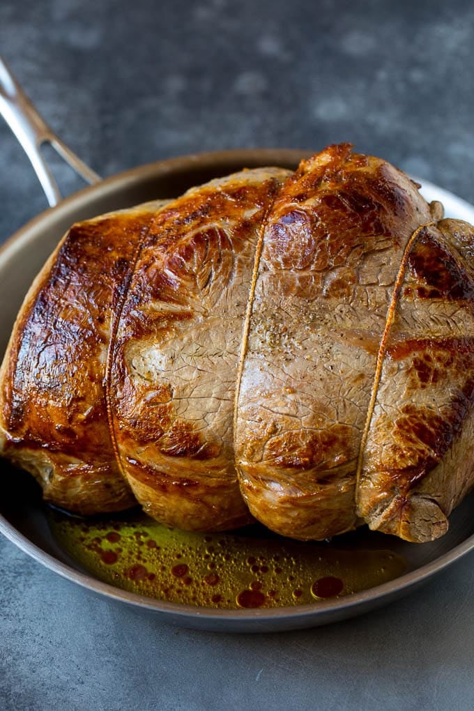 A browned chuck roast in a pan.