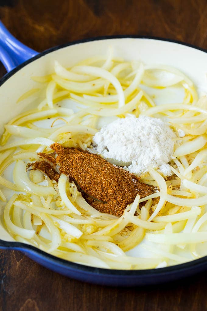 Onions, spices and flour in a pan.