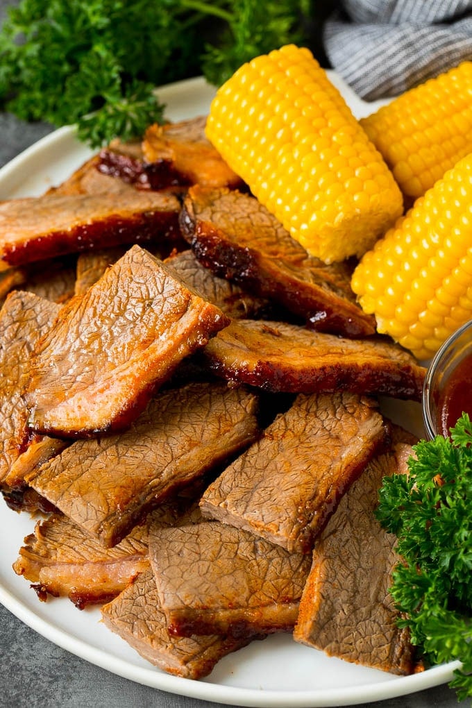 Sliced beef brisket on a serving platter.