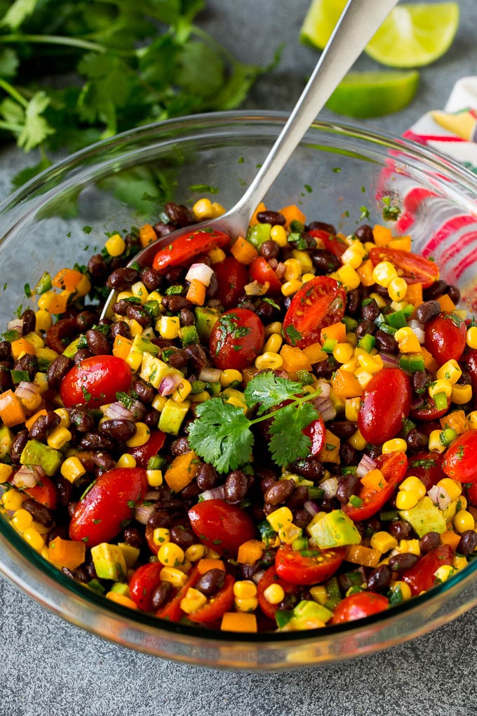 A bowl of black bean salad garnished with cilantro.