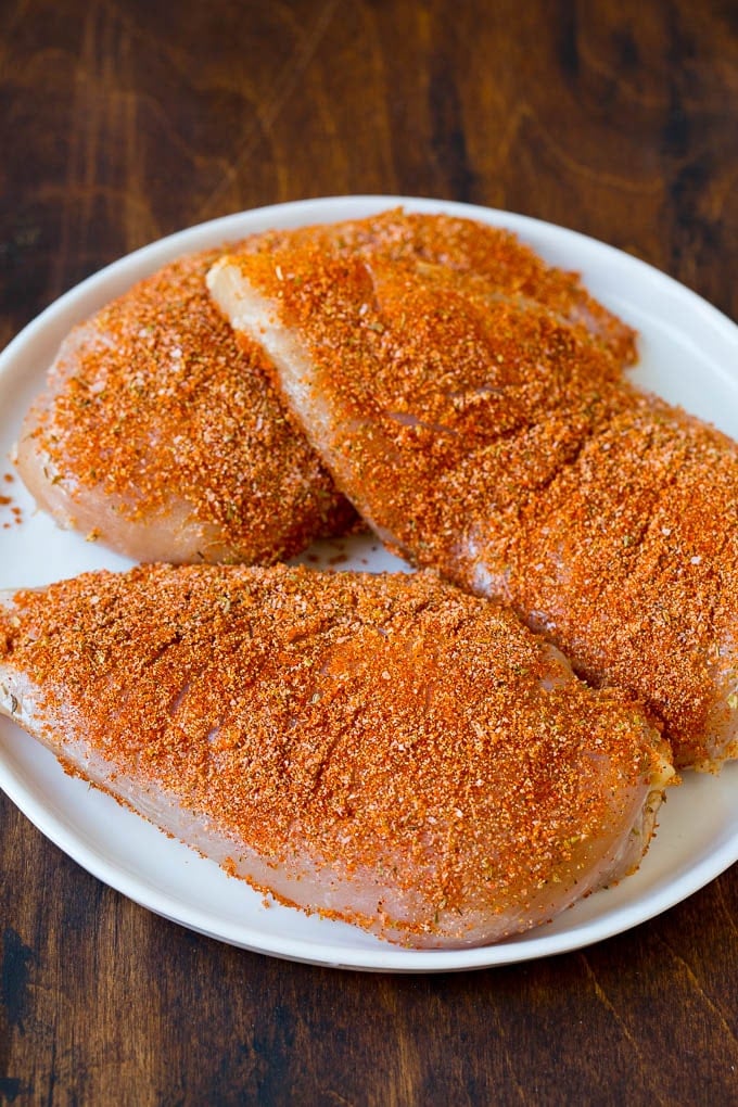 Chicken breasts coated in spices.