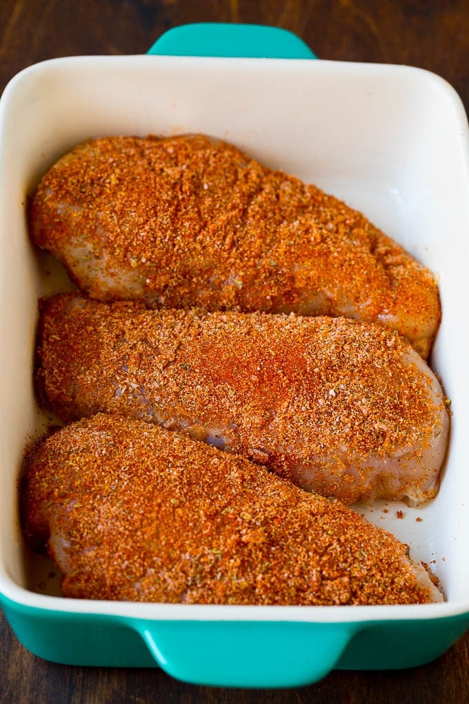 Spice crusted chicken breasts in a baking dish.