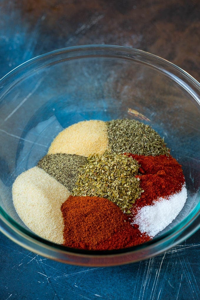 Paprika, garlic powder, onion powder and herbs in a mixing bowl.